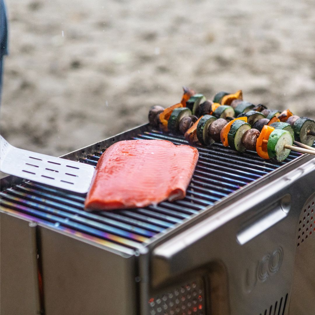 UCO_stainless_steel_grill_portable_for_camping_cookouts_cook_gourmet_meals_at_camp