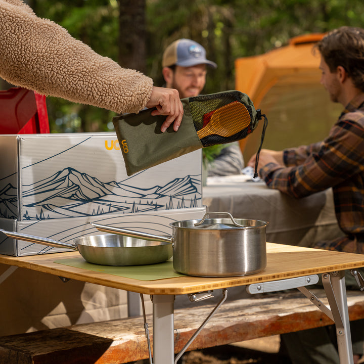 UCO Cookit Camp Kitchen setup with stainless steel camp cooking equipment